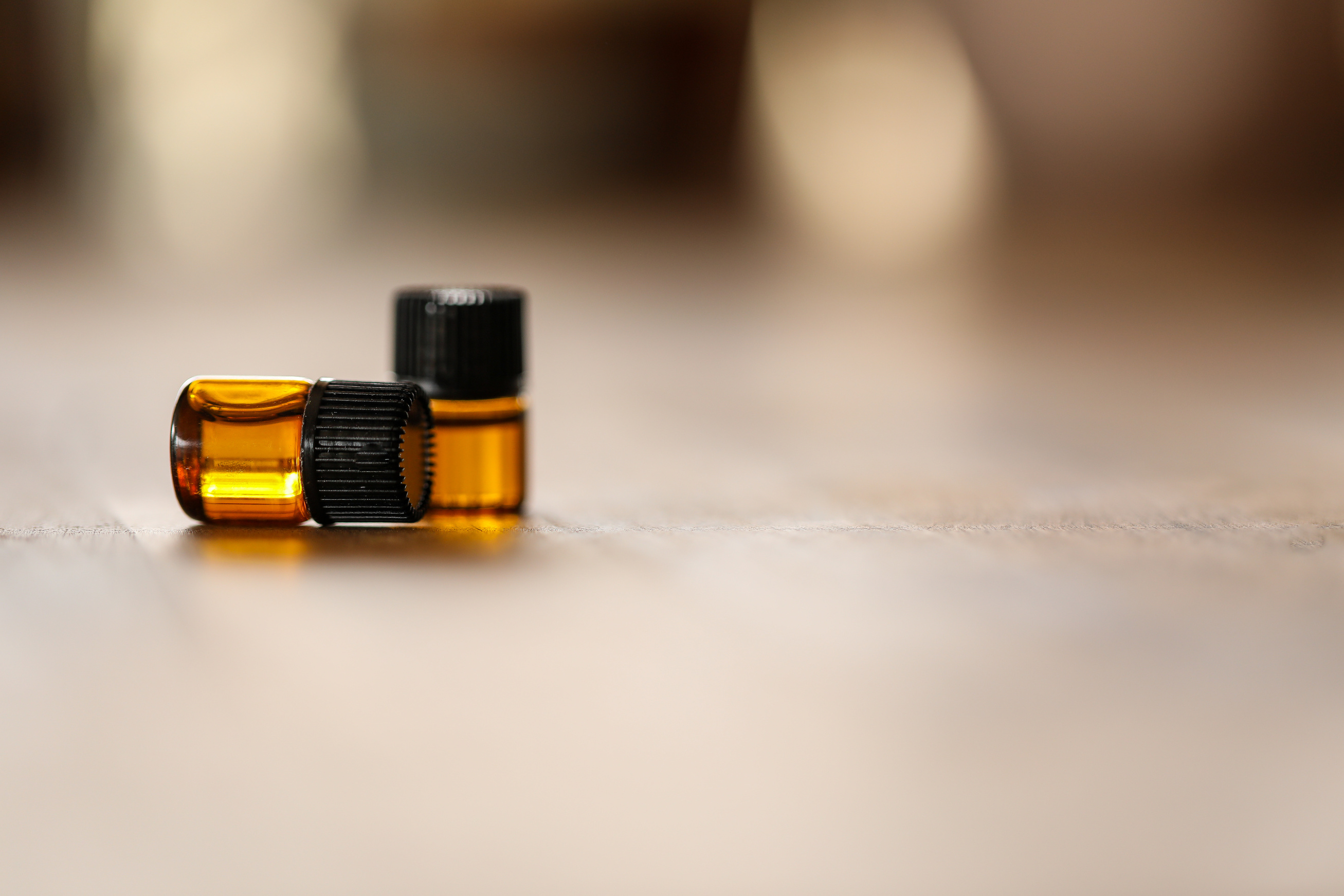 Essential oil sample drams with blurred background